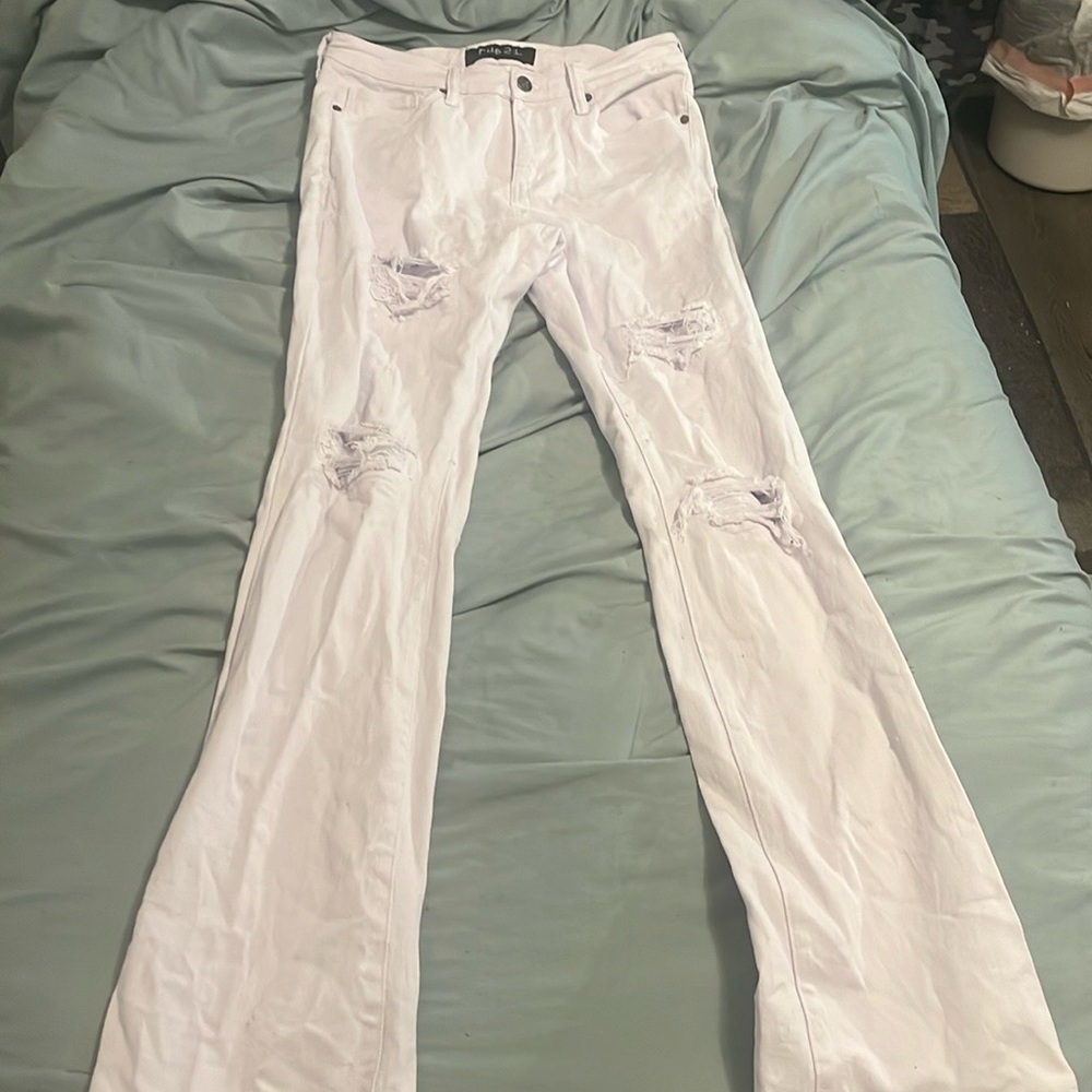 White skinny jeans with re-pared rips.